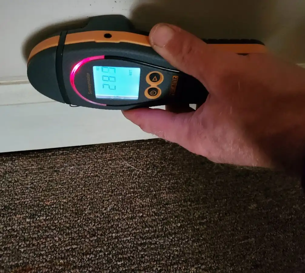 Moisture detection at baseboard during Storm Damage Restoration in Arkadelphia